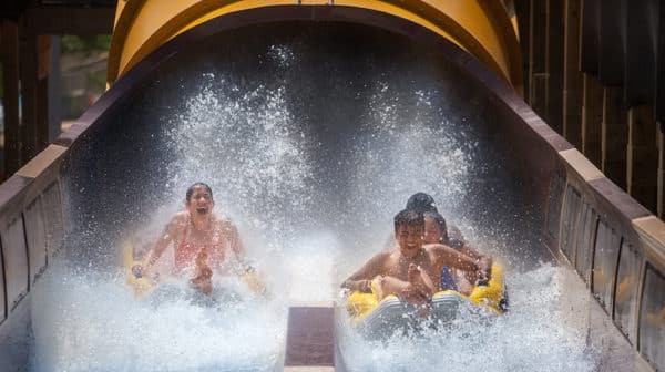 Three people splash down on two rafts from the Cheetah Chase water coaster at Holiday World & Splashin' Safari