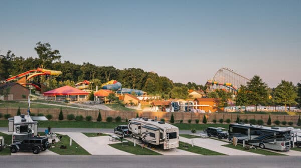 Several campers and vehicles set on campsites at Sun Outdoors Lake Rudolph and overlook Holiday World & Splashin' Safari
